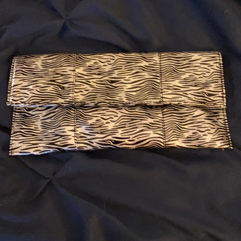 Metallic zebra clutch